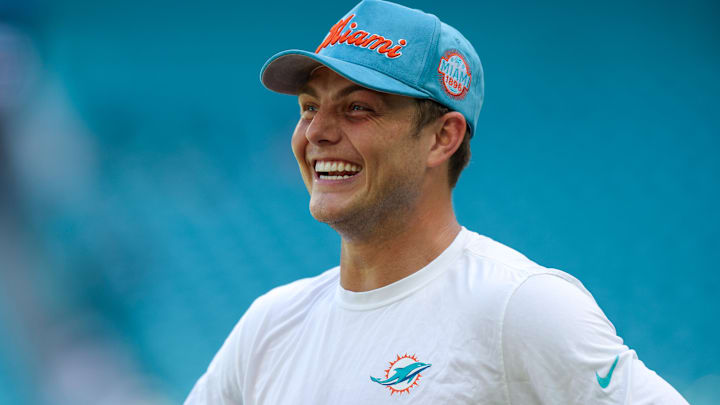 Miami Dolphins quarterback Zach Wilson (0) looks on before a game against the New England Patriots at Hard Rock Stadium.