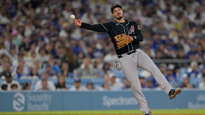 Mar 28, 2026; Los Angeles, California, USA; Arizona Diamondbacks third baseman Nolan Arenado (28) throws to first for an out during the eighth inning against the Los Angeles Dodgers at Dodger Stadium. Mandatory Credit: Jayne Kamin-Oncea-Imagn Images