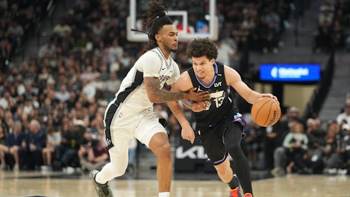 Dec 27, 2025; San Antonio, Texas, USA; Utah Jazz guard Walter Clayton Jr. (13) drives to the basket against San Antonio Spurs guard Stephon Castle (5) during the first half at Frost Bank Center. Mandatory Credit: Scott Wachter-Imagn Images Dec 27, 2025; San Antonio, Texas, USA; Utah Jazz guard Walter Clayton Jr. (13) drives to the basket against San Antonio Spurs guard Stephon Castle (5) during the first half at Frost Bank Center. Mandatory Credit: Scott Wachter-Imagn Images