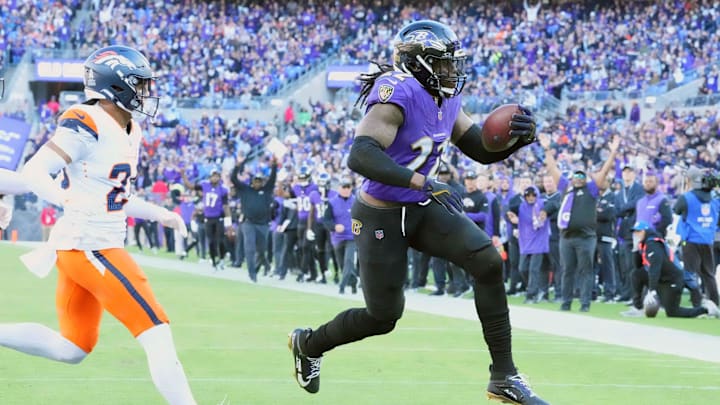 Nov 3, 2024; Baltimore, Maryland, USA; Baltimore Ravens running back Derrick Henry (22) scores a third quarter touchdown against the Denver Broncos at M&T Bank Stadium. Mandatory Credit: Mitch Stringer-Imagn Images