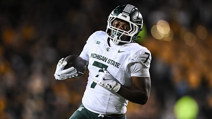 Nov 22, 2025; Iowa City, Iowa, USA; Michigan State Spartans running back Brandon Tullis (7) runs the ball against the Iowa Hawkeyes during the third quarter at Kinnick Stadium. Mandatory Credit: Jeffrey Becker-Imagn Images
