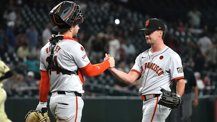 Sep 24, 2024; Phoenix, Arizona, USA; San Francisco Giants catcher Patrick Bailey (14) and pitcher Austin Warren (57) celebrate after defeating the Arizona Diamondbacks at Chase Field.