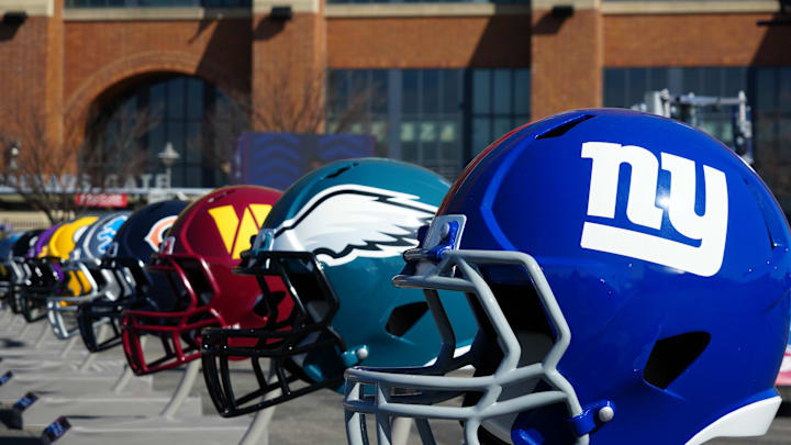 Feb 28, 2024; Indianapolis, IN, USA; A general view of large New York Giants and Philadelphia Eagles helmets at the NFL Scouting Combine Experience at Lucas Oil Stadium. Mandatory Credit: Kirby Lee-Imagn Images