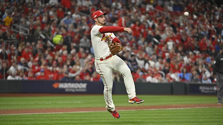Oct 8, 2022; St. Louis, Missouri, USA; St. Louis Cardinals third baseman Nolan Arenado (28) throws out Philadelphia Phillies second baseman Jean Segura (2) at first base in the seventh inning during game two of the Wild Card series for the 2022 MLB Playoffs at Busch Stadium. Mandatory Credit: Jeff Curry-Imagn Images
