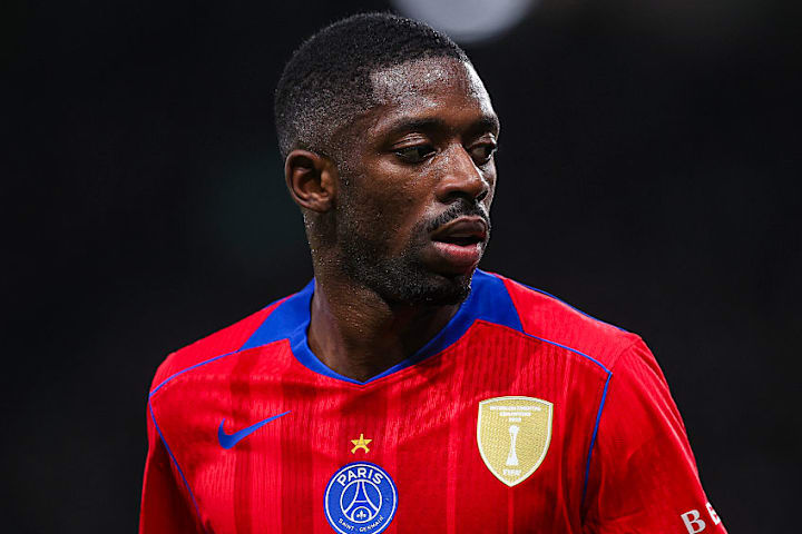 Ousmané Dembélé gazing to one side.