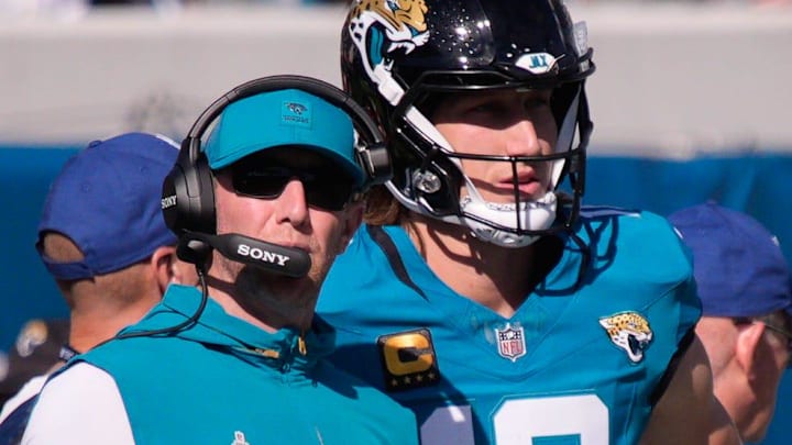 Jacksonville Jaguars head coach Liam Coen talks with Jacksonville Jaguars quarterback Trevor Lawrence (16) during the first quarter during an NFL football game at EverBank Stadium, Sunday, Dec. 14, 2025, in Jacksonville, Fla. [Doug Engle/Florida Times-Union]