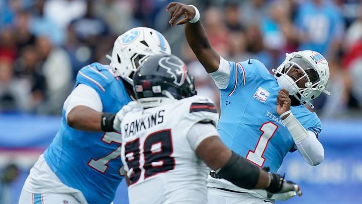 Tennessee Titans quarterback Cam Ward (1) launches the ball under pressure during the second quarter against the Houston Texans at Nissan Stadium in Nashville, Tenn., Sunday, Oct. 11, 2026. Tennessee Titans quarterback Cam Ward (1) launches the ball under pressure during the second quarter against the Houston Texans at Nissan Stadium in Nashville, Tenn., Sunday, Oct. 11, 2026.