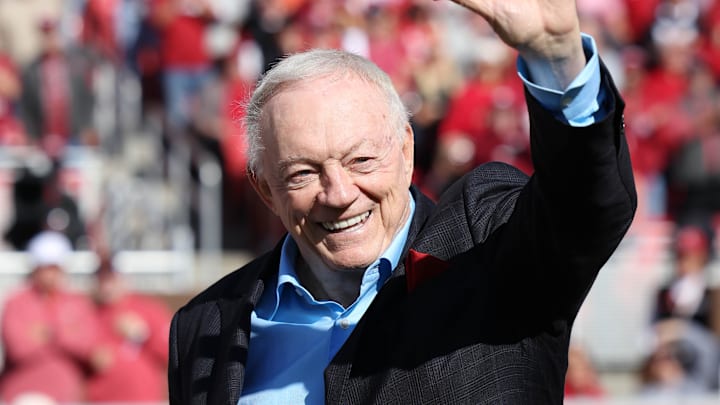 Nov 16, 2024; Fayetteville, Arkansas, USA; Dallas Cowboys owner and member of the 1964 Arkansas Razorbacks National Championship team, Jerry Jones, waves to the crowd as the team is honored during the first half against the Texas Longhorns at Donald W. Reynolds Razorback Stadium. Mandatory Credit: Nelson Chenault-Imagn Images