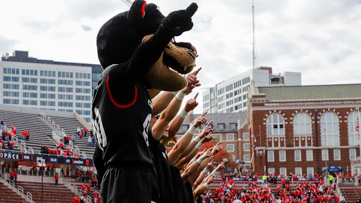 Oct 21, 2023; Cincinnati, Ohio, USA; The Cincinnati Bearcats mascot points to the sky during the playing of the alma mater before the game against the Baylor Bears at Nippert Stadium. Mandatory Credit: Katie Stratman-Imagn Images