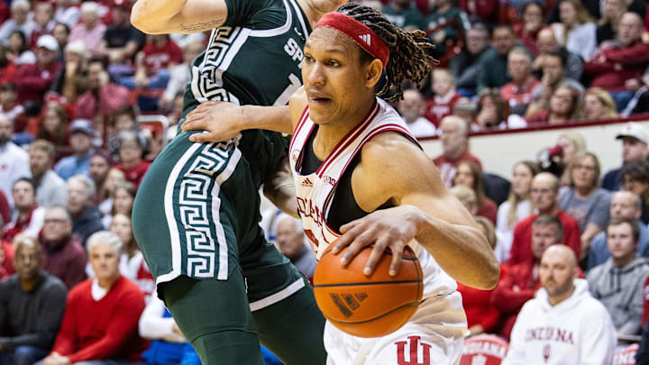 Indiana forward Malik Reneau (5) dribbles past Michigan State center Carson Cooper (15) at Simon Skjodt Assembly Hall. 