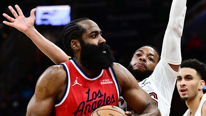 Nov 23, 2025; Cleveland, Ohio, USA; Los Angeles Clippers guard James Harden (1) drives to the basket against Cleveland Cavaliers guard Darius Garland (10) during the second half at Rocket Arena. Mandatory Credit: Ken Blaze-Imagn Images