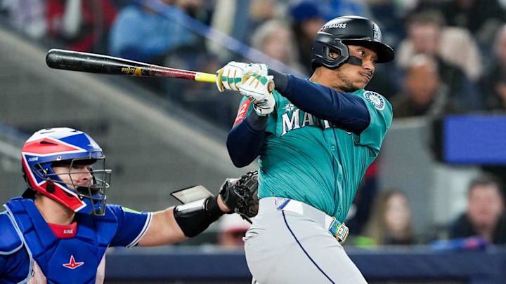 Oct 13, 2025; Toronto, Ontario, CAN; Seattle Mariners infielder Jorge Polanco (7) singles in the seventh inning against the Toronto Blue Jays during game two of the ALCS round for the 2025 MLB playoffs at Rogers Centre. Mandatory Credit: Nick Turchiaro-Imagn Images Oct 13, 2025; Toronto, Ontario, CAN; Seattle Mariners infielder Jorge Polanco (7) singles in the seventh inning against the Toronto Blue Jays during game two of the ALCS round for the 2025 MLB playoffs at Rogers Centre. Mandatory Credit: Nick Turchiaro-Imagn Images
