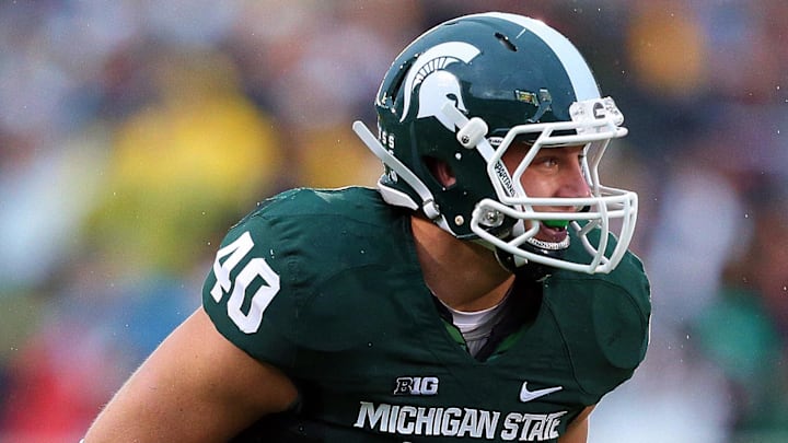 Nov 2, 2013; East Lansing, MI, USA; Michigan State Spartans linebacker Max Bullough (40) before the snap of the ball during the 2nd half of a game against the Michigan Wolverines at Spartan Stadium. MSU won 29-6. Mandatory Credit: Mike Carter-Imagn Images