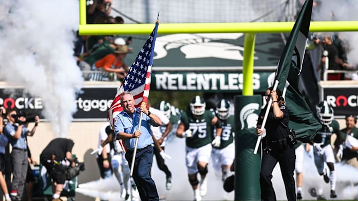 East Lansing first responders run onto the field with the Spartans before Michigan State's football game against Youngstown State on Saturday, Sept. 11, 2021, in East Lansing.

210911 Msu Youngstown Fb 088a
