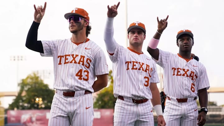 Texas Longhorns Aiden Robbins, Casey Borba and Anthony Pack Jr. throw up the Hook 'Em Horns. Texas Longhorns Aiden Robbins, Casey Borba and Anthony Pack Jr. throw up the Hook 'Em Horns.