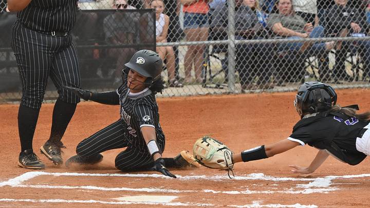 Gray Collegiate Academy's Aspen Boulware beats the tag attempt by North Augusta. 