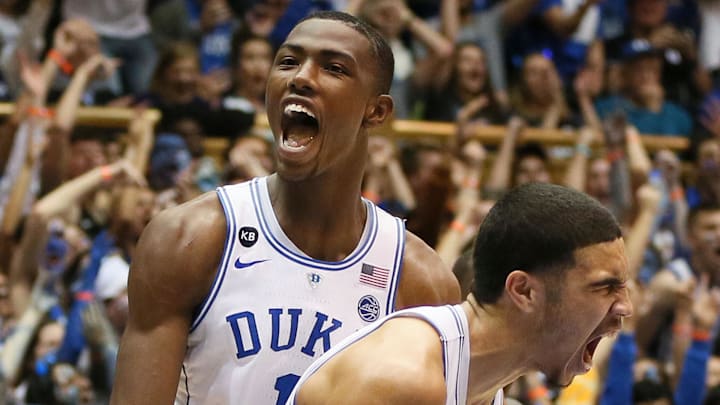 Feb 9, 2017; Durham, NC, USA; Duke Blue Devils forward Harry Giles (1) and forward Jayson Tatum (0) react after Tatum scored against the North Carolina Tar Heels in the second half of their game at Cameron Indoor Stadium. Mandatory Credit: Mark Dolejs-Imagn Images