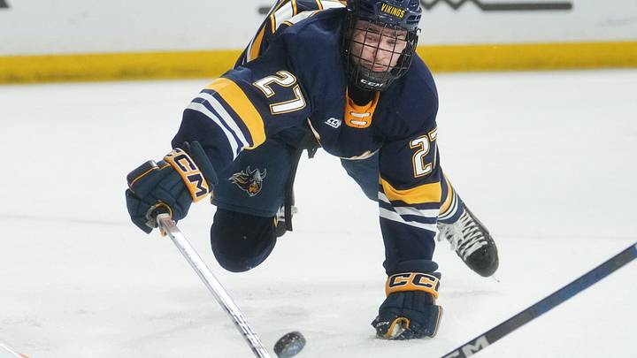 Augustana Vikings forward Chase Brand dives for the puck against the ASU Sun Devils at Mullett Arena in Tempe on Jan. 19, 2024. Augustana Vikings forward Chase Brand dives for the puck against the ASU Sun Devils at Mullett Arena in Tempe on Jan. 19, 2024.