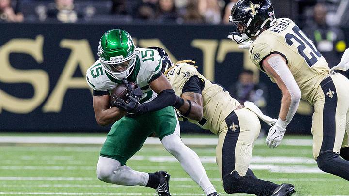 Dec 21, 2025; New Orleans, Louisiana, USA;  New Orleans Saints safety Justin Reid (21) tackles New York Jets wide receiver Adonai Mitchell (15) during the second half  at Caesars Superdome. Mandatory Credit: Stephen Lew-Imagn Images