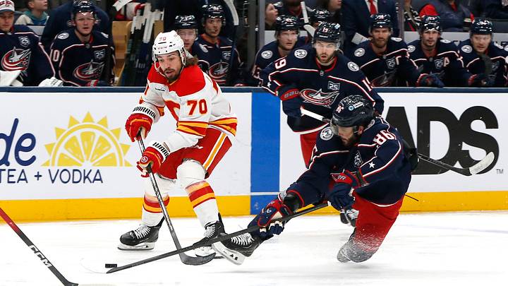 Jan 13, 2026; Columbus, Ohio, USA; Calgary Flames left wing Ryan Lomberg (70) sweeps the puck off the stick of Columbus Blue Jackets right wing Kirill Marchenko (86) during the second period at Nationwide Arena. Mandatory Credit: Russell LaBounty-Imagn Images Jan 13, 2026; Columbus, Ohio, USA; Calgary Flames left wing Ryan Lomberg (70) sweeps the puck off the stick of Columbus Blue Jackets right wing Kirill Marchenko (86) during the second period at Nationwide Arena. Mandatory Credit: Russell LaBounty-Imagn Images