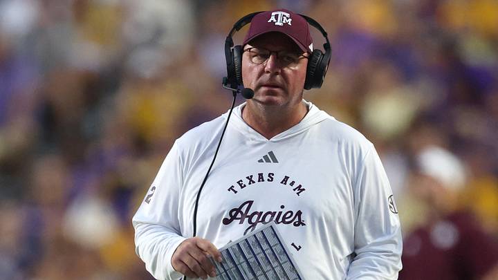 Sep 26, 2026; Baton Rouge, Louisiana, USA;  Texas A&M Aggies head coach Mike Elko walks on the field during a time-out during the first quarter against the LSU Tigers xat Tiger Stadium.  Mandatory Credit: Stephen Lew-Imagn Images