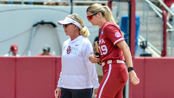 Oklahoma coach Patty Gasso talks to pitcher Berkley Zache in the circle against Mississippi State in the Norman Super Regional.