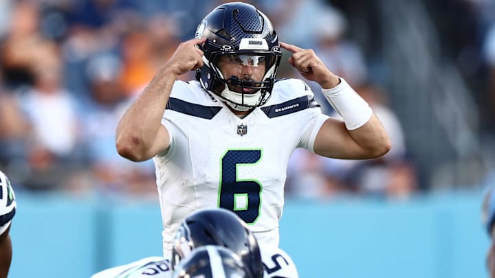 Aug 17, 2024; Nashville, Tennessee, USA; Seattle Seahawks quarterback Sam Howell (6) signals to his team before a play in the first quarter against the Tennessee Titans at Nissan Stadium.