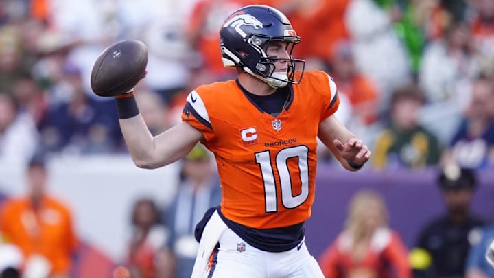 Dec 14, 2025; Denver, Colorado, USA; Denver Broncos quarterback Bo Nix (10) throws downfield during the second quarter against the Green Bay Packers at Empower Field at Mile High. 