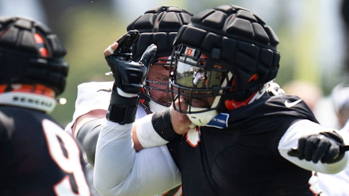 Cincinnati Bengals guard Alex Cappa (65) blocks Cincinnati Bengals defensive tackle Sheldon Rankins (98) during Cincinnati Bengals training camp in Cincinnati on Friday, July 26, 2024.