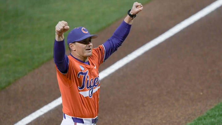 Clemson Head Coach Erik Bakich pumps his fists toward fans before the first pitch with South Carolina at Doug Kingsmore Stadium in Clemson, S.C. Wednesday, Feb 28, 2025.