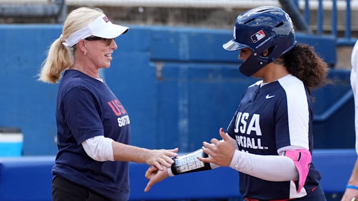 Jocelyn Alo high fives Patty Gasso after hitting a home run in the USA Softball Showcase at Devon Park.