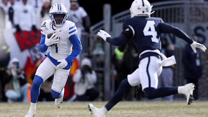 SMU's Brashard Smith tries to elude a Penn State tackler in the open field. Smith said he has a 30 visit with the Bears coming.