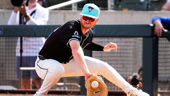 Arizona Diamondbacks first baseman Pavin Smith makes an out at first on ball hit by Kansas City Royals Jac Caglianone in the third inning during a spring training game at Salt River Fields at Talking Stick on Feb. 28, 2025, in Scottsdale. Arizona Diamondbacks first baseman Pavin Smith makes an out at first on ball hit by Kansas City Royals Jac Caglianone in the third inning during a spring training game at Salt River Fields at Talking Stick on Feb. 28, 2025, in Scottsdale.