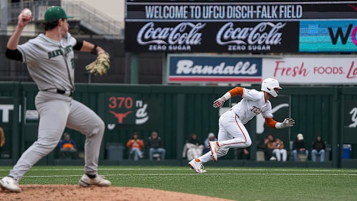 Texas Longhorns outfielder Max Belyeu (44) runs back to second as Dartmouth pitcher Joseph Chambers (20) throws to second during the game at UFCU Disch-Falk Field on Friday, Feb. 21, 2025.
