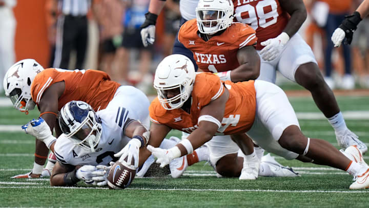 Texas Longhorns defensive lineman Jaray Bledsoe recovers a BYU Cougars fumble in the fourth quarter at Royal-Memorial Stadium on Saturday October 28, 2023.
