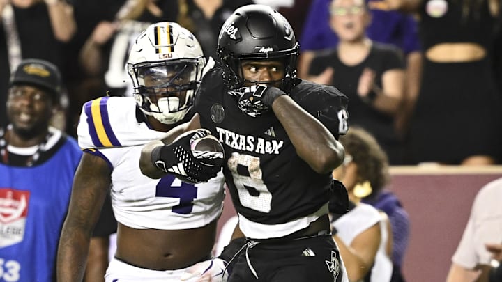 Oct 26, 2024; College Station, Texas, USA; Texas A&M Aggies running back Le'Veon Moss (8) reacts against the LSU Tigers during the third quarter. The Aggies defeated the Tigers 38-23; at Kyle Field. Mandatory Credit: Maria Lysaker-Imagn Images.