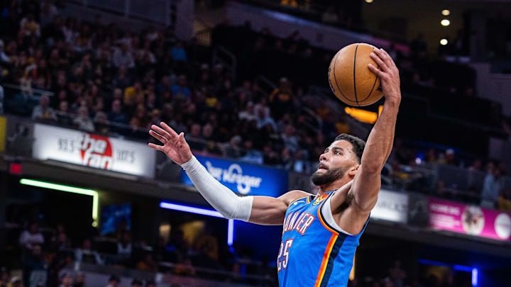 Oct 23, 2025; Indianapolis, Indiana, USA; Oklahoma City Thunder guard Ajay Mitchell (25) shoots the ball while Indiana Pacers guard Bennedict Mathurin (00) defends in the first half at Gainbridge Fieldhouse. Oct 23, 2025; Indianapolis, Indiana, USA; Oklahoma City Thunder guard Ajay Mitchell (25) shoots the ball while Indiana Pacers guard Bennedict Mathurin (00) defends in the first half at Gainbridge Fieldhouse.