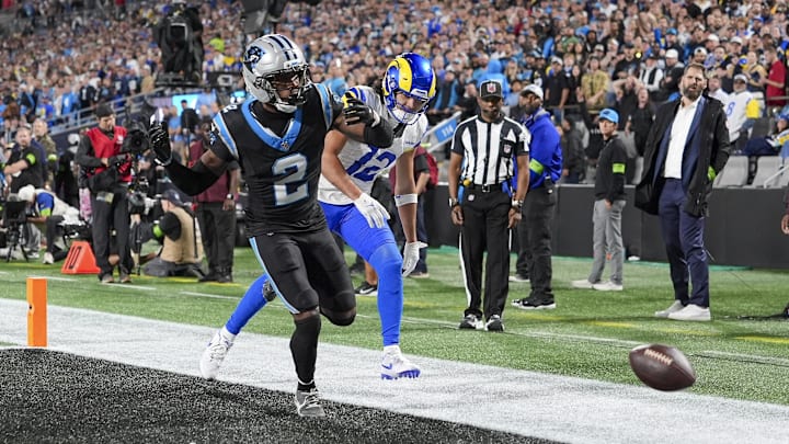 Jan 10, 2026; Charlotte, NC, USA; Carolina Panthers cornerback Mike Jackson (2) breaks up a pass play for Los Angeles Rams wide receiver Puka Nacua (12) during the second half of the NFC Wild Card Round game between the Carolina Panthers and the Los Angeles Rams at Bank of America Stadium. Mandatory Credit: Jim Dedmon-Imagn Images