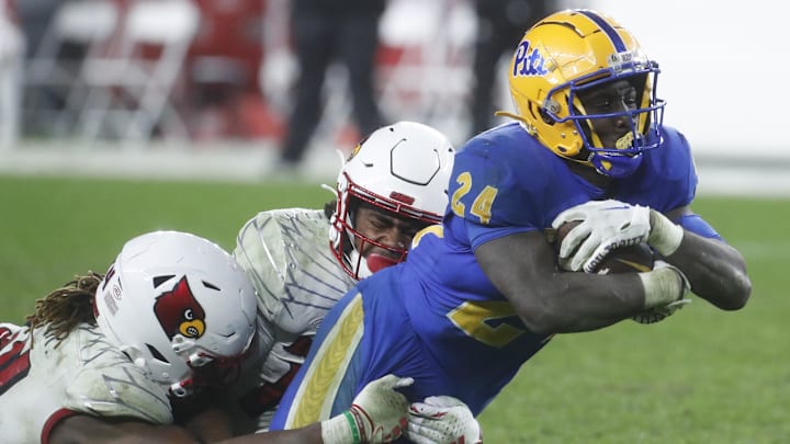 Oct 14, 2023; Pittsburgh, Pennsylvania, USA; Pittsburgh Panthers running back C'Bo Flemister (24) dives for additional yardage against the Louisville Cardinals during the fourth quarter at Acrisure Stadium. Pittsburgh won 38-21. Mandatory Credit: Charles LeClaire-Imagn Images