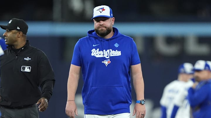 Blue Jays manager John Schneider (14) reacts after the benches clear in the fourth inning against the Los Angeles Dodgers during game seven of the 2025 MLB World Series at Rogers Centre. Blue Jays manager John Schneider (14) reacts after the benches clear in the fourth inning against the Los Angeles Dodgers during game seven of the 2025 MLB World Series at Rogers Centre.