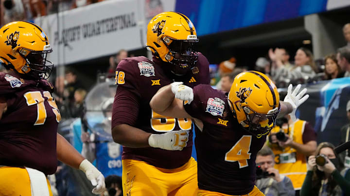 Arizona State running back Cam Skattebo (4) celebrates after a touchdown against Texas during the fourth quarter in the Chick-fil-A Peach Bowl in Atlanta on Wednesday, Jan. 1, 2025.