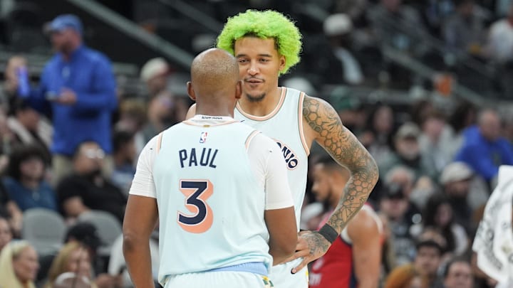 Dec 8, 2024; San Antonio, Texas, USA; San Antonio Spurs guard Chris Paul (3) and San Antonio Spurs forward Jeremy Sochan (10) in the second half against the New Orleans Pelicans at Frost Bank Center.