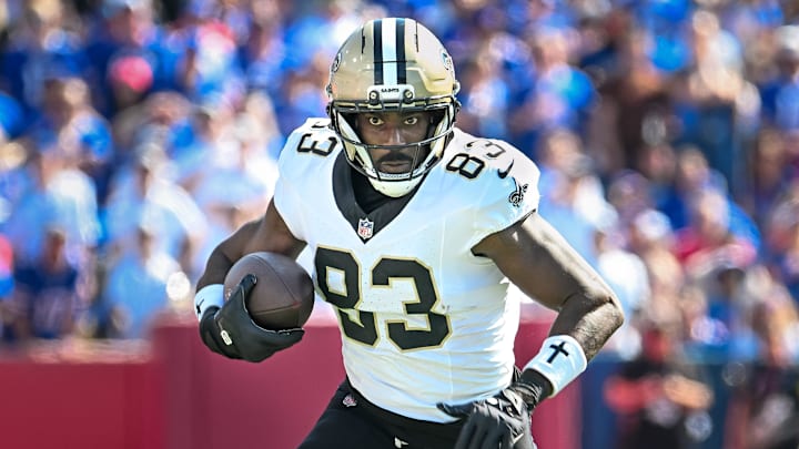Sep 28, 2025; Orchard Park, New York, USA; New Orleans Saints tight end Juwan Johnson (83) runs after making a catch against the Buffalo Bills in the first quarter at Highmark Stadium. Mandatory Credit: Mark Konezny-Imagn Images