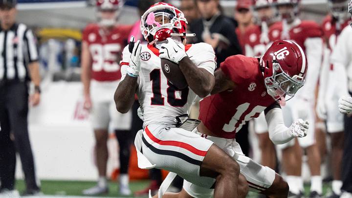 Dec 6, 2025; Atlanta, GA, USA; Georgia wide receiver Sacovie White-Helton (18) spins away from a tackle by Alabama defensive back Red Morgan (16) at Mercedes-Benz Stadium. Mandatory Credit: Gary Cosby Jr.-Tuscaloosa News