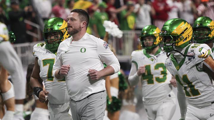 Jan 9, 2026; Atlanta, GA, USA; Oregon Ducks head coach Dan Lanning leads his team onto the field prior to the 2025 Peach Bowl and semifinal game of the College Football Playoff against the Indiana Hoosiers at Mercedes-Benz Stadium. Mandatory Credit: Brett Davis-Imagn Images Jan 9, 2026; Atlanta, GA, USA; Oregon Ducks head coach Dan Lanning leads his team onto the field prior to the 2025 Peach Bowl and semifinal game of the College Football Playoff against the Indiana Hoosiers at Mercedes-Benz Stadium. Mandatory Credit: Brett Davis-Imagn Images
