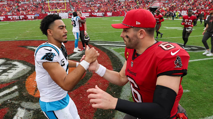 Dec 29, 2024; Tampa, Florida, USA; Tampa Bay Buccaneers quarterback Baker Mayfield (6) great Carolina Panthers quarterback Bryce Young (9) after a game at Raymond James Stadium. Mandatory Credit: Nathan Ray Seebeck-Imagn Images