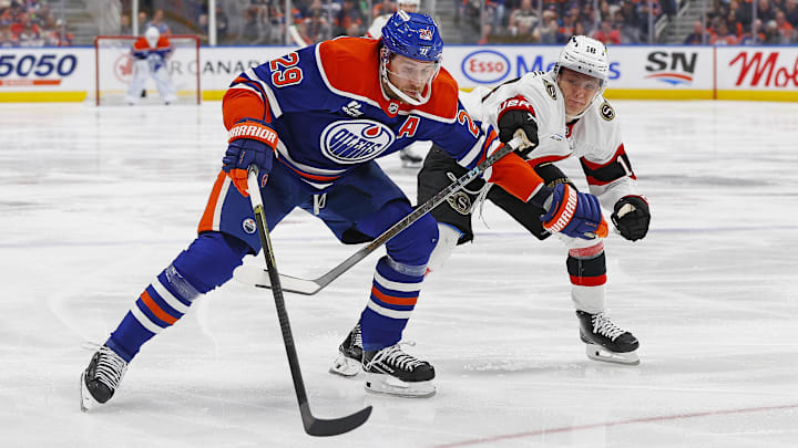 Mar 3, 2026; Edmonton, Alberta, CAN; Edmonton Oilers forward Leon Draisaitl (29) carries the puck around Ottawa Senators defensemen Jordan Spence (10) during the third period at Rogers Place. Mandatory Credit: Perry Nelson-Imagn Images