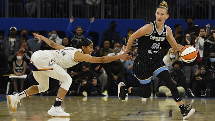 Oct 17, 2021; Chicago, Illinois, USA; Chicago Sky guard Courtney Vandersloot (22) dribbles the ball against Phoenix Mercury guard Skylar Diggins-Smith (4) during the second half of game four of the 2021 WNBA Finals at Wintrust Arena. Mandatory Credit: Matt Marton-Imagn Images