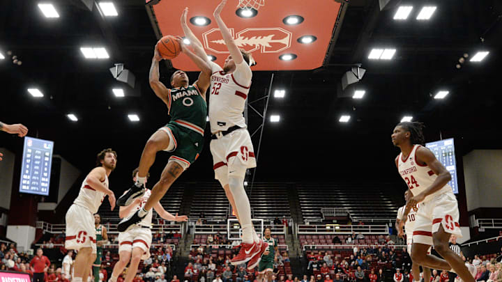 Jan 22, 2025; Stanford, California, USA; Miami (FL) Hurricanes guard Matthew Cleveland (0) attempts a basket against Stanford Cardinal forward Aidan Cammann (52) in the second half at Maples Pavilion. Mandatory Credit: Eakin Howard-Imagn Images Jan 22, 2025; Stanford, California, USA; Miami (FL) Hurricanes guard Matthew Cleveland (0) attempts a basket against Stanford Cardinal forward Aidan Cammann (52) in the second half at Maples Pavilion. Mandatory Credit: Eakin Howard-Imagn Images