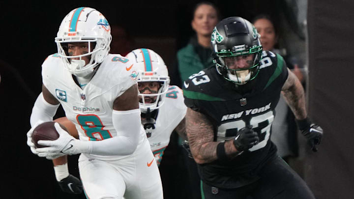 Jevon Holland of Miami returned this interception for a 100 yard TD in the first half as the Miami Dolphins defeated the NY Jets 34-13 at MetLife Stadium on November 24, 2023 in East Rutherford, NJ to play in the first Black Friday NFL game.